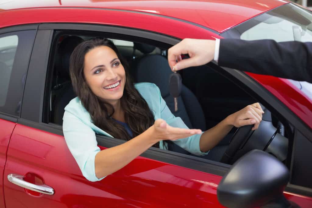 16729714 businessman holding car keys by his fingertips